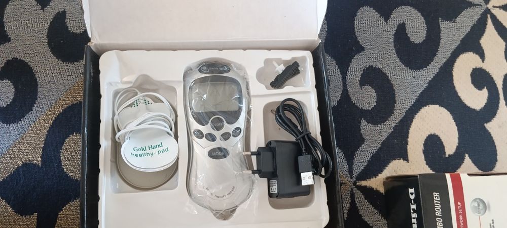 Электронный миостимулирующий массажер.