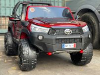 Masinuta electrica pentru 2 copii Toyota Hilux 4WD RuggedX 2021 #RED