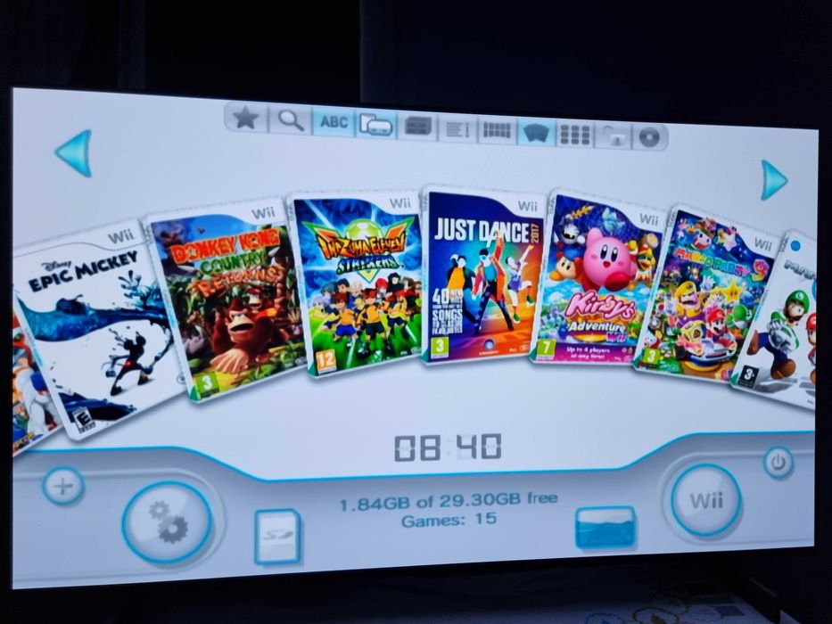 Nintendo Wii modat + stick cu jocuri