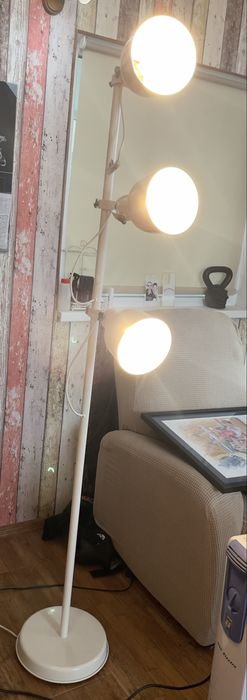 white IKEA Hektar floor lamp with 3-spotlights.