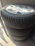 Anvelope ca noi noute cu jante tabla si capace originale Bmw pe 205.55