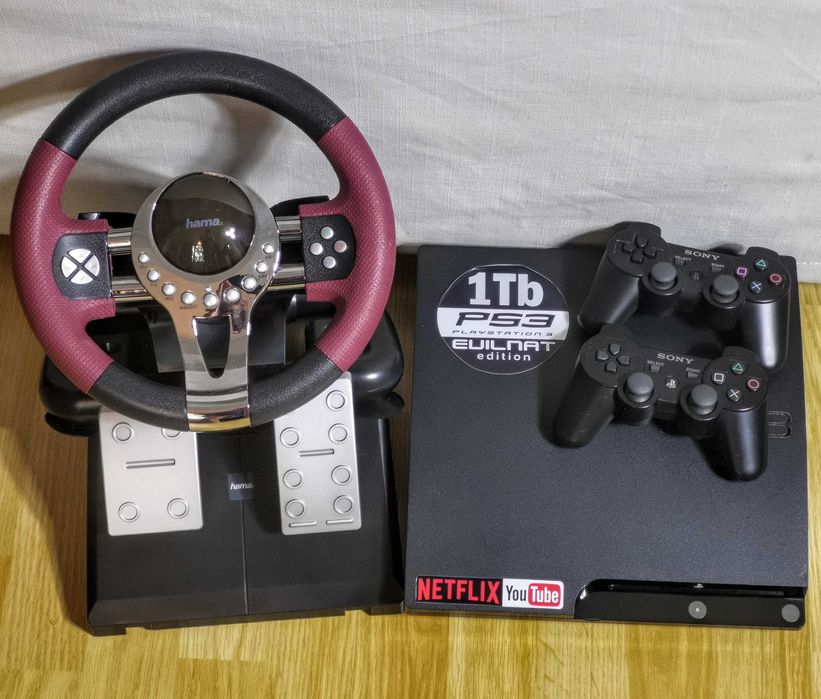 PS3 1Tb cu 90 jocuri + 2 manete + volan cu pedale + NETFLIX + YOUTUBE