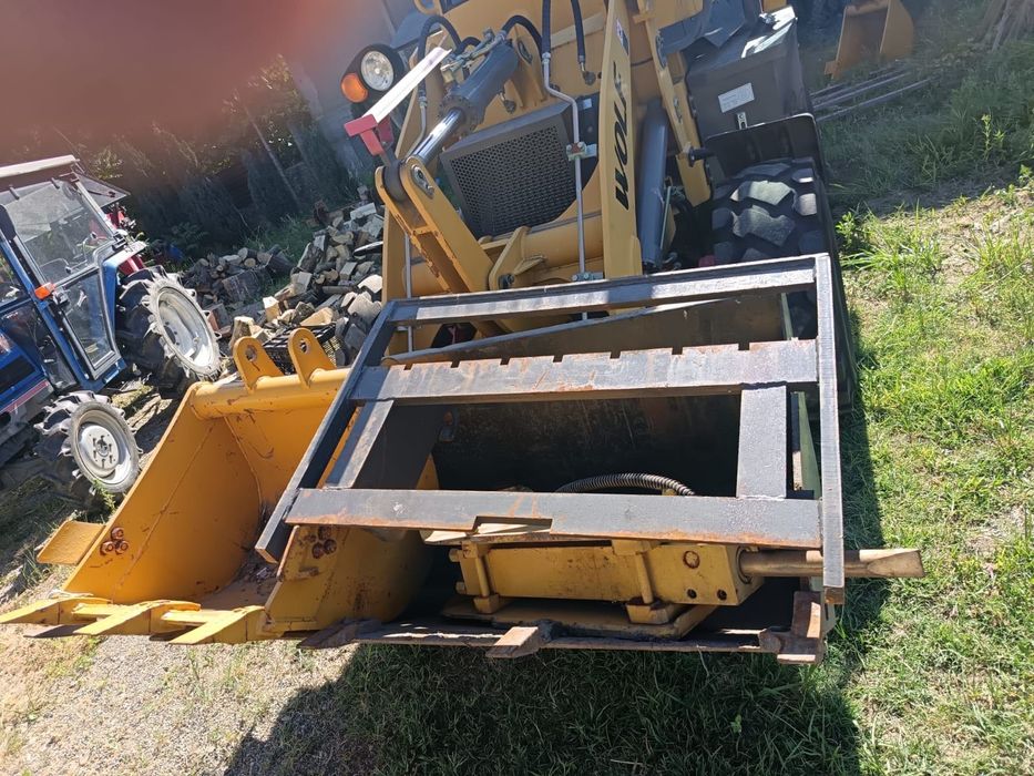 Buldoexcavator WOLF an 2020 cu doar 100 ore