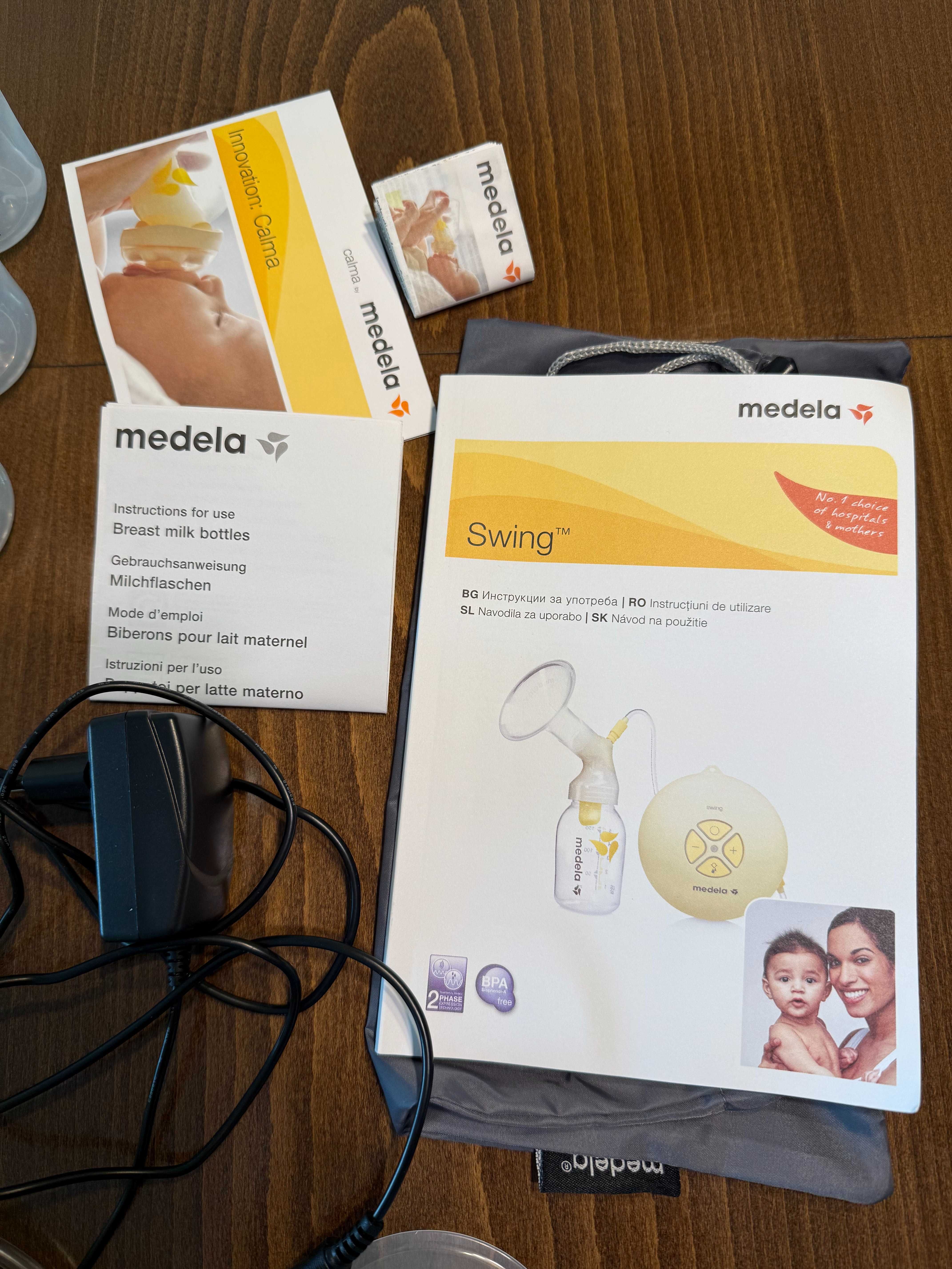 Електрическа помпа за кърма Medela Swing с аксесоари и 7 шишета