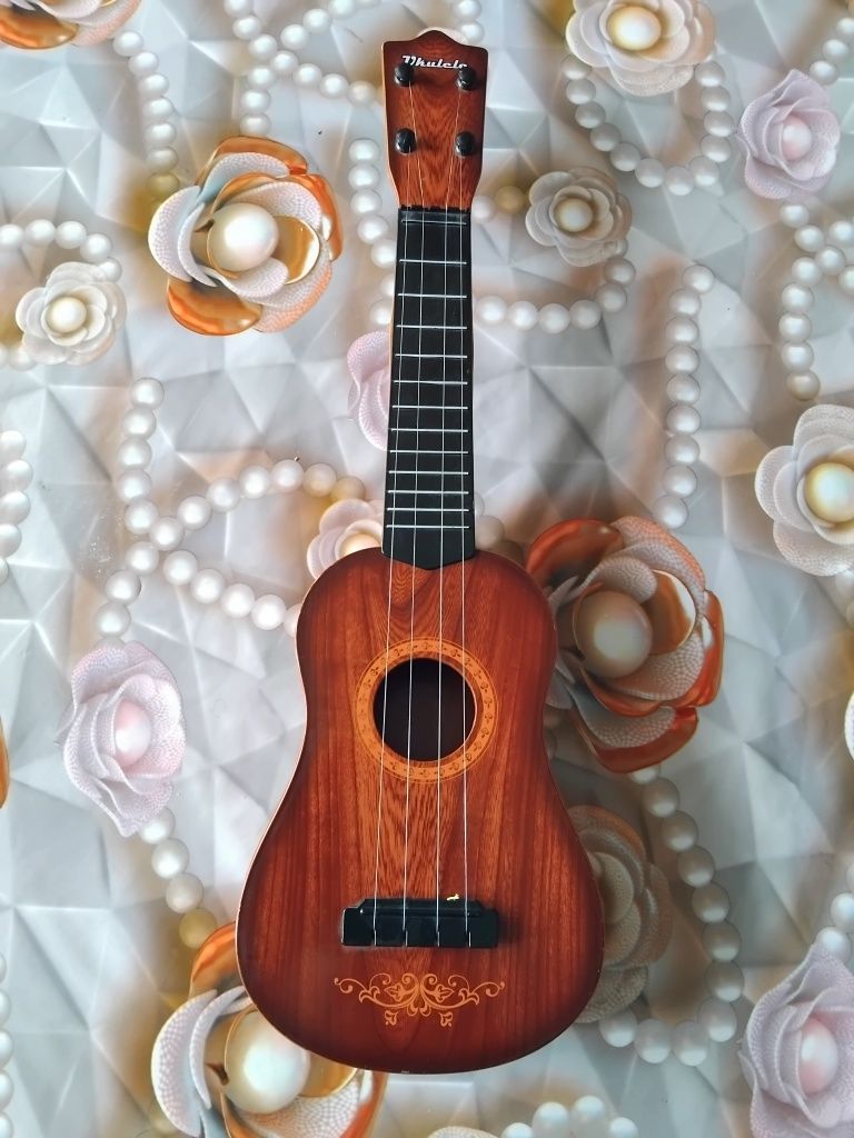 Mini Gitara chalgʻu asbob sirochna sotiladi