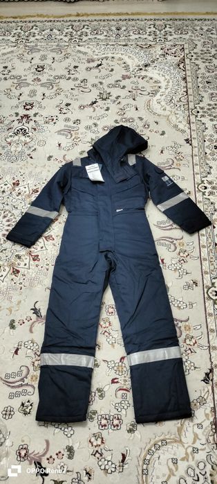 Продам зимний комбез новый