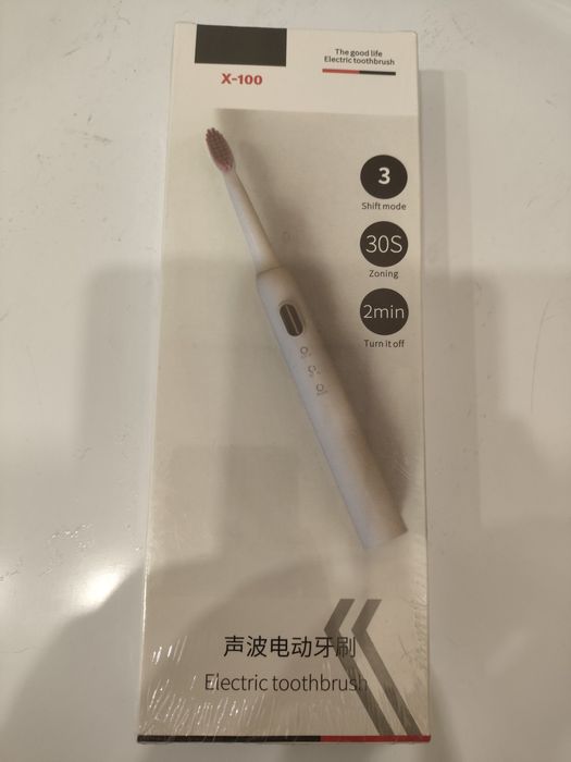 Электрическая зубная щетка