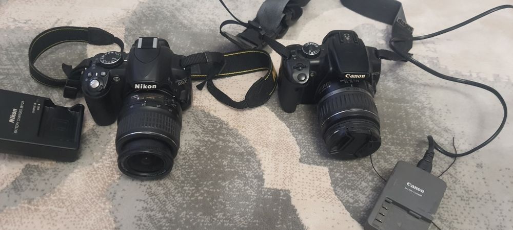 Aparate photo Nikon D3100 și Canon Eos