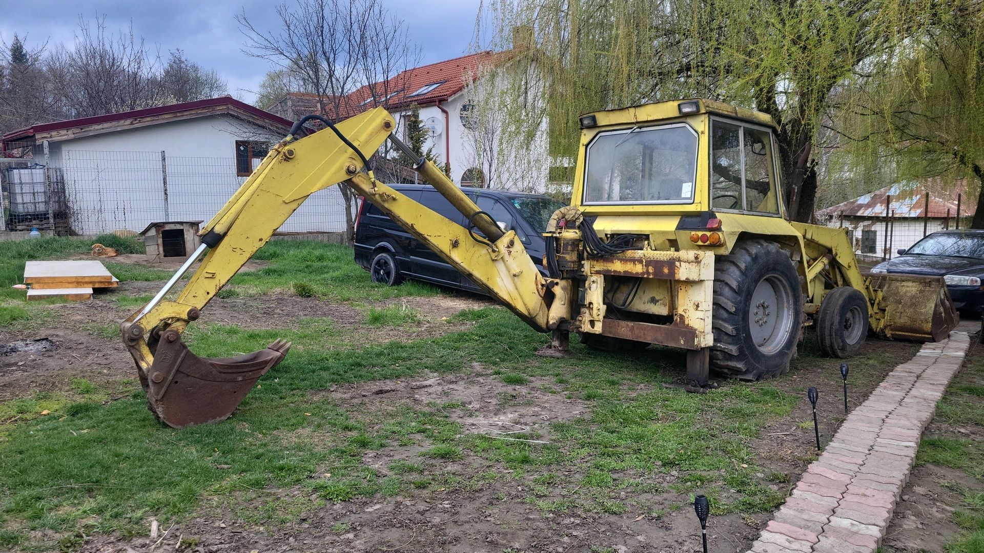 Buldoexcavator MF,schimb cu duba xxl sau autorulota.