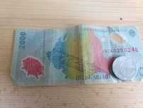 Bancnota, ochelari  si moneda cu eclipsa 1999