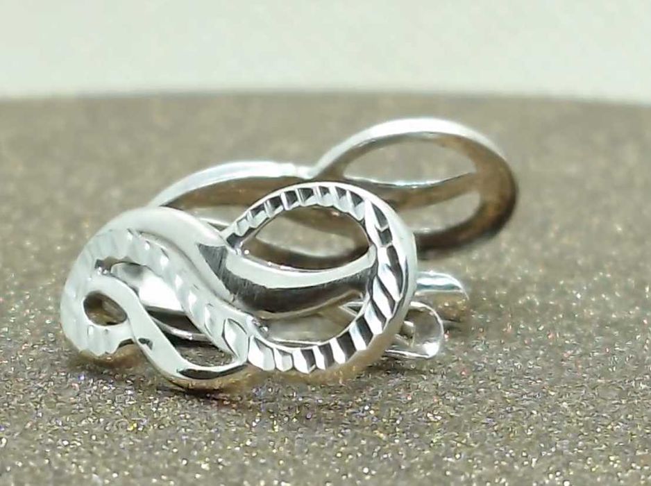 Cercei din argint 925 – model buclă “infinity”, fațetare diamond-cut