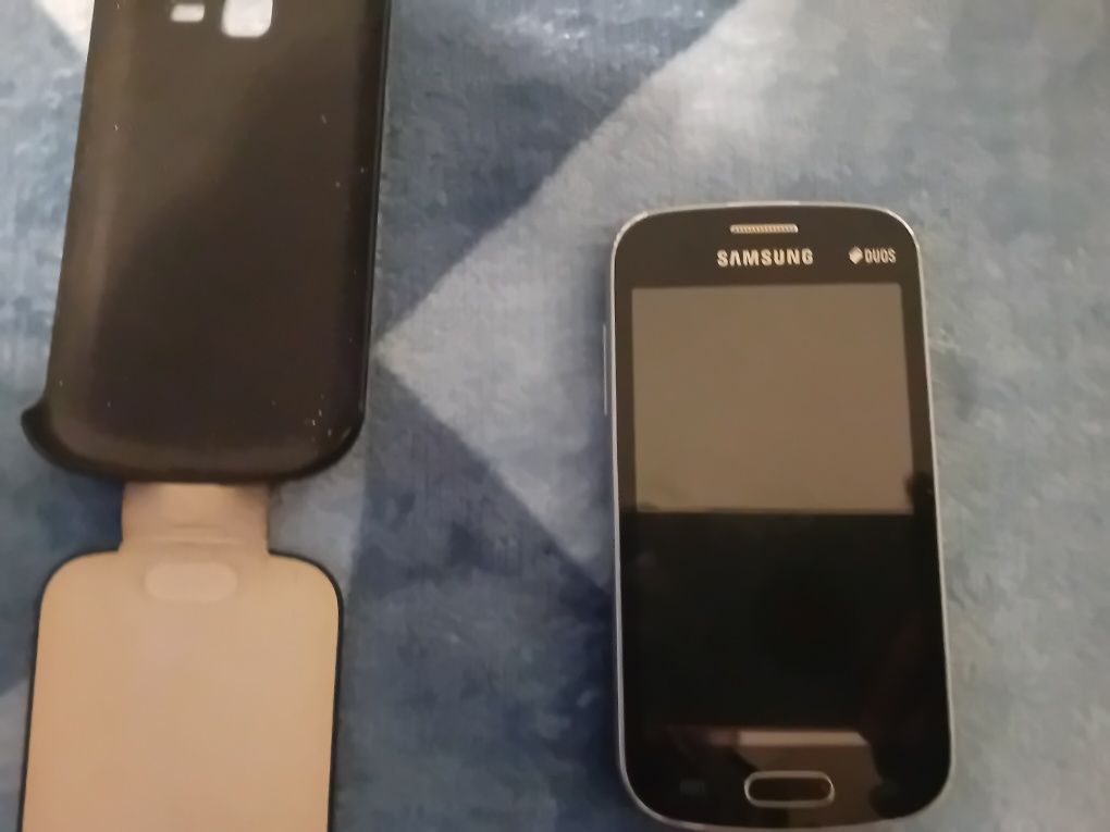 Samsung GtS7392, husă piele, folosit, 40 lei