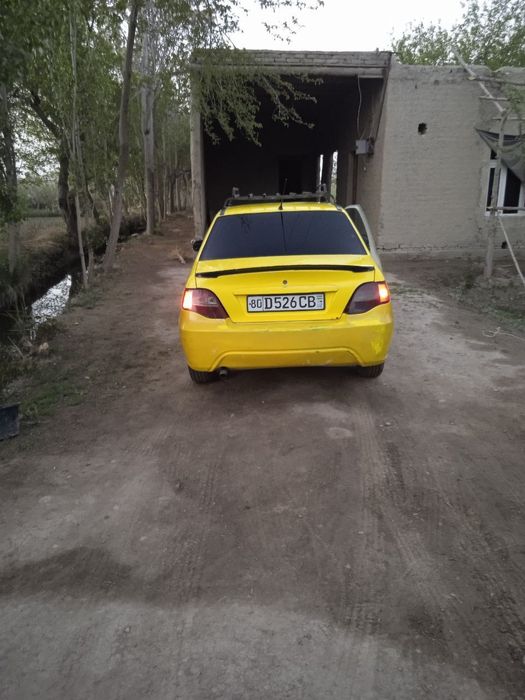 Nexia 2  2010yil sonstramblyor rangi sariq