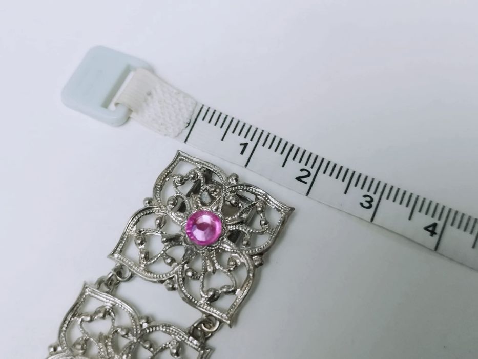 Veche bratara in filigran, placata cu argint, cu pietre roz
