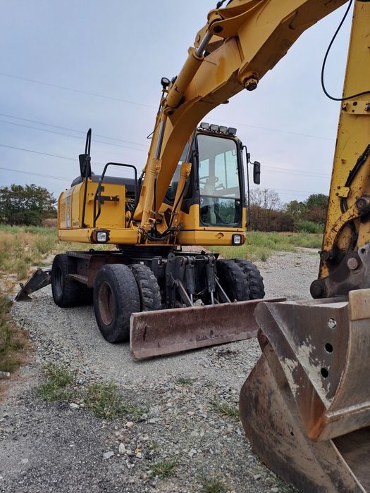 Vind excavator komatsu pw140