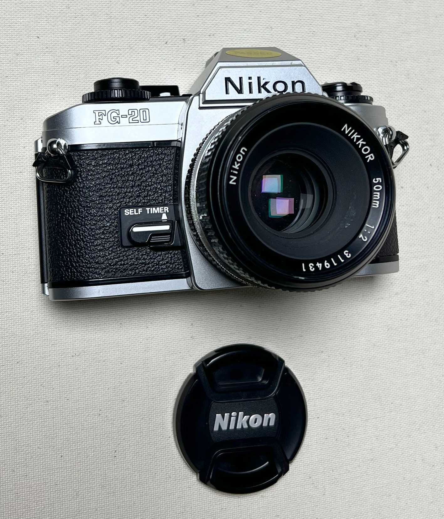 Nikon FG-20 + Nikkor 50mm/2, foto film, colectie