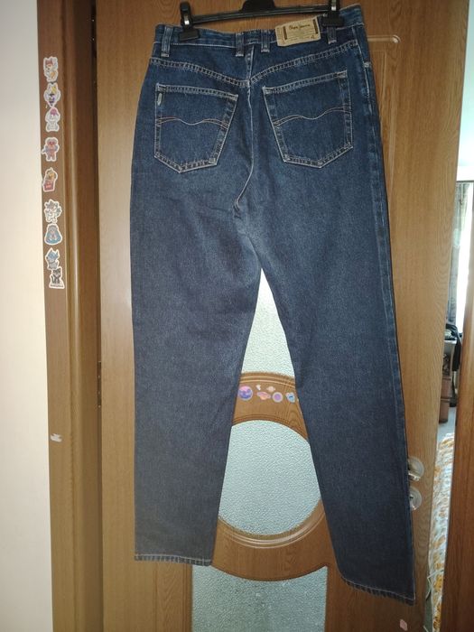 Vând blugi albaștri închis