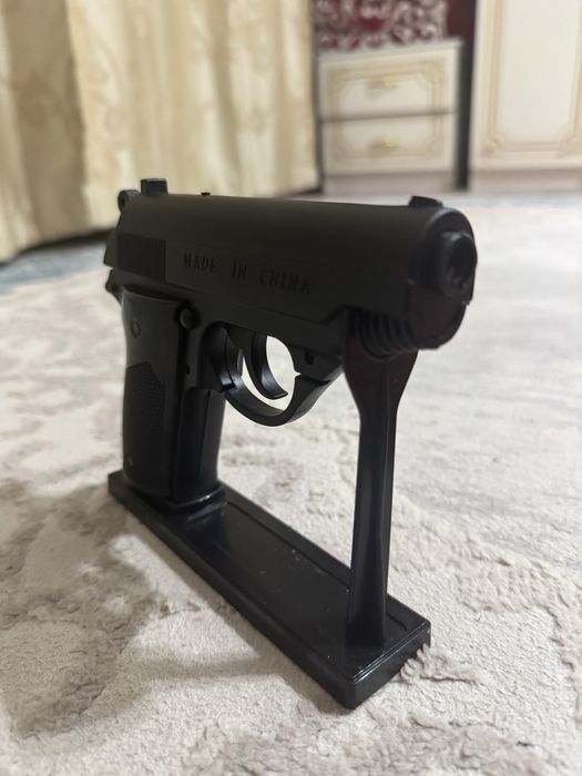 Зажигалка пистолет игрушка