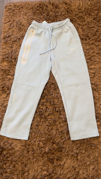 Pantaloni Nike Tech X Nocta albastri