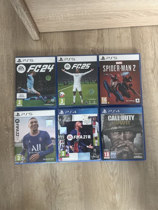 PS5 cu 2 manete si 7 jocuri