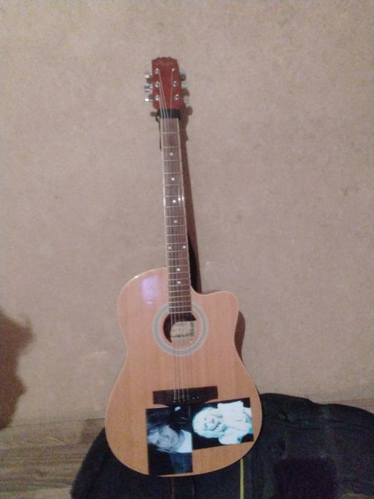 Продам гитару Aries