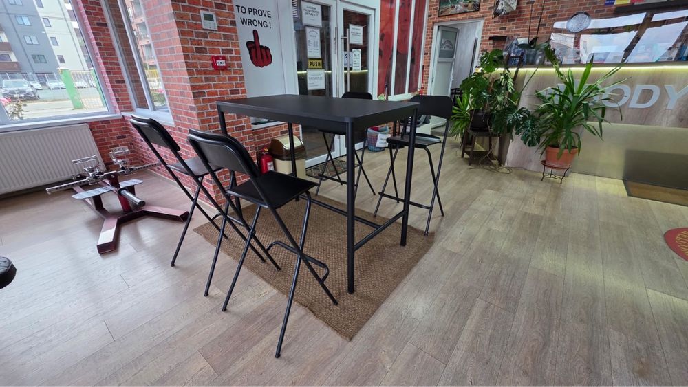 Black ikea bar table and bar stool foldable with brown rug