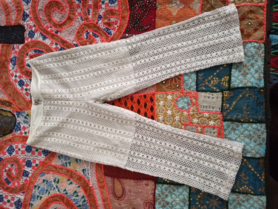 Pantaloni trei sferturi