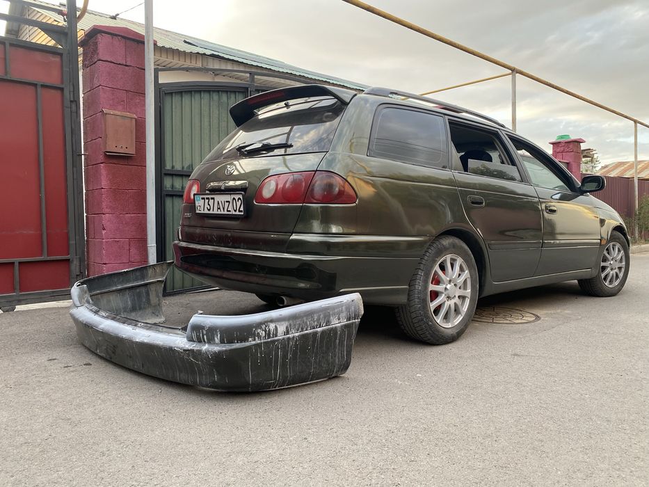 Бампер задний тойота калдина 210