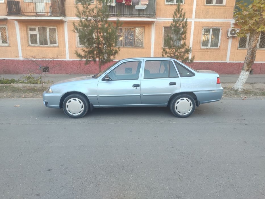 Нексия 2  Сонс гибрит матор лукс-кандисанер 2014 йил 320минг юргани  к