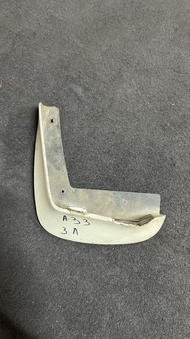 Брызговик Ниссан Максима А33 задний левый