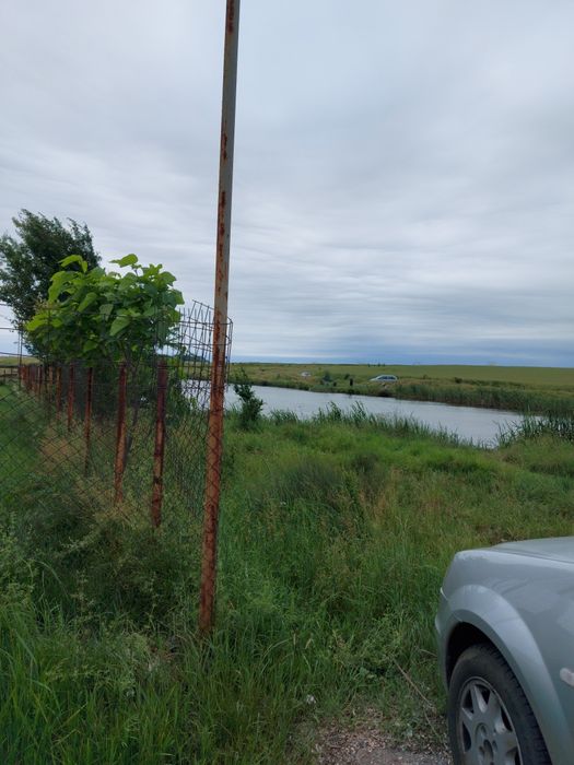 Teren,în spate la Peugeot,DN65,vecin cu LACUL,zonă de recreere.