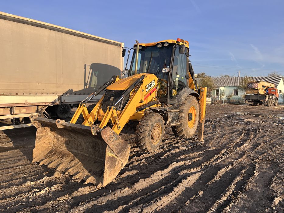 Услуги экскаватора-погрузчика.