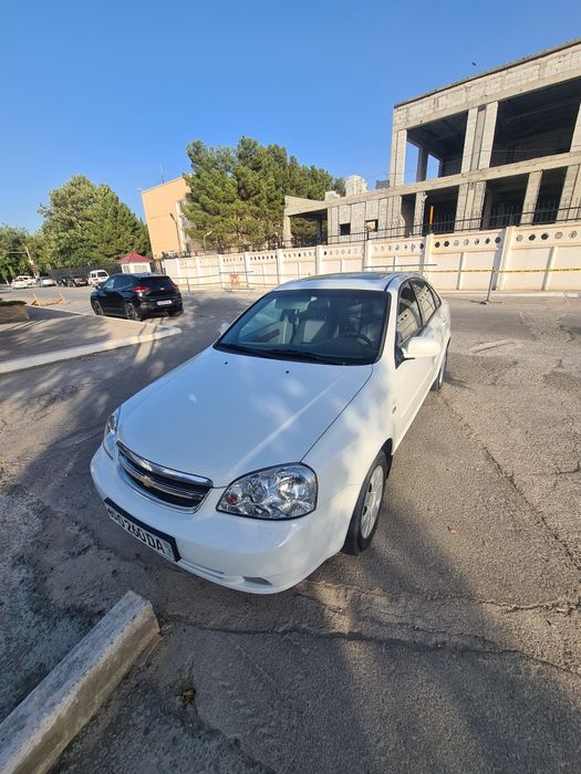 Ласитти 2009 тозза краскаси чуруган жойи йук масла