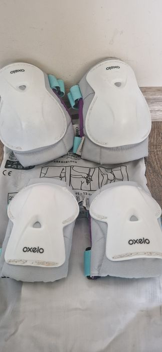 Комплект "Оxelo" съдържсщ накитници, налакътници и наколенки.