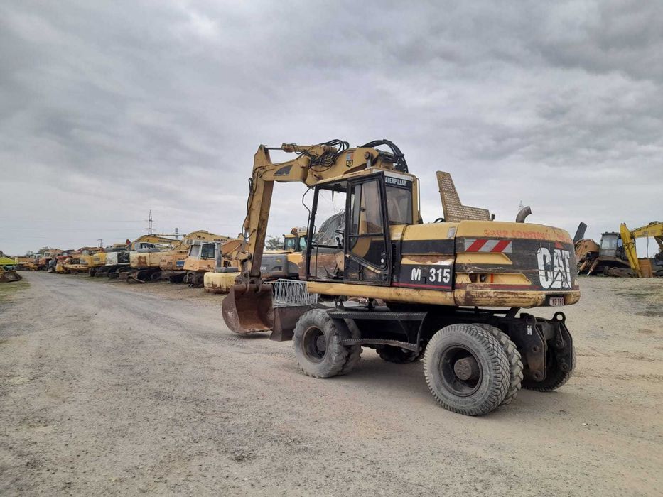 Piese excavator pe roti Caterpillar M 315