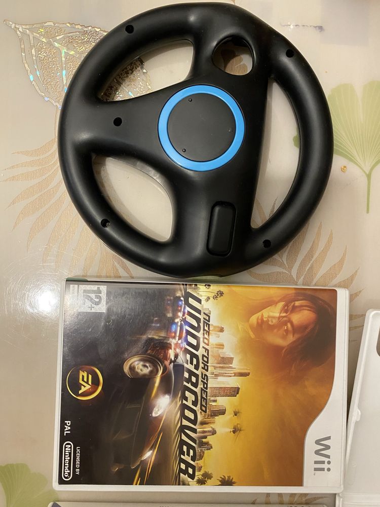 Продавам комплект игри и волан за Nintendo Wii