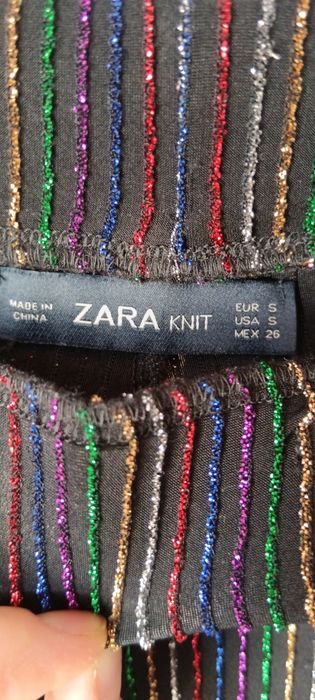 Pantaloni eleganți cu sclipici elastici multicolor purtați o singura d