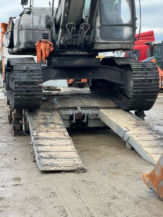 Transport utilaje cu trailer agabaritic pe latime