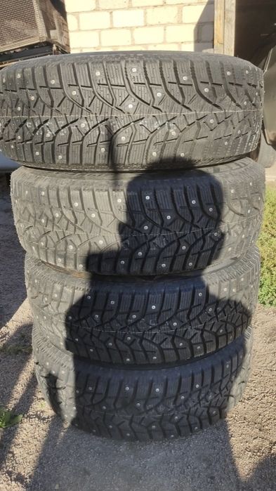 Шины Bridgestone зимние шипы R14 185/65