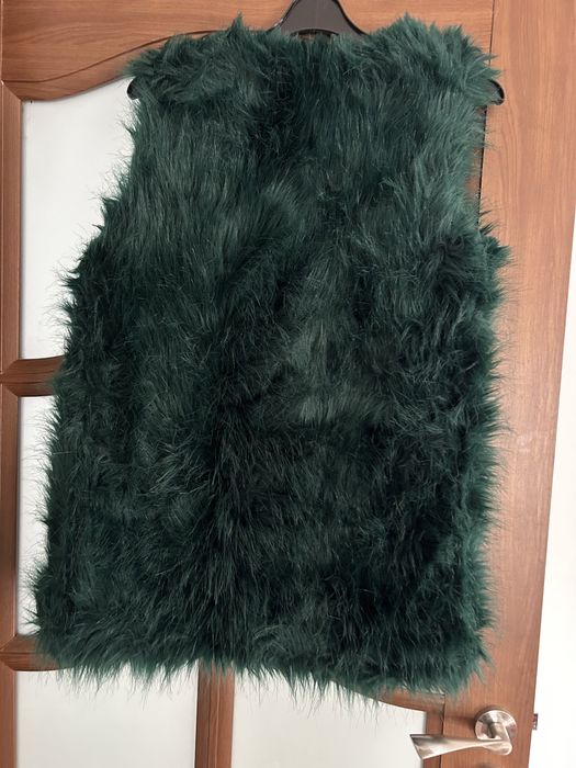 Vesta de blana.
