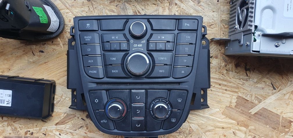 Grilă / consolă Opel Astra J bloc lumini /  panou AC radio MP3 confort