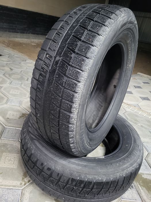 Продам  зимние. шины в паре BRIDGESTON  215 / 60/ 16
