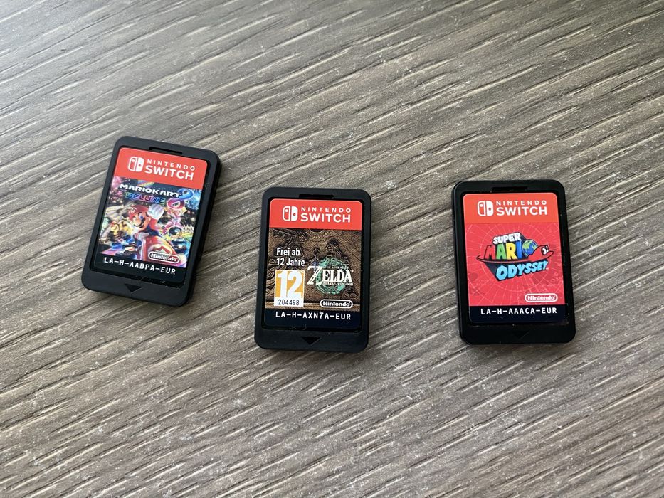 Nintendo Switch OLED 64GB + 4 jocuri(Schimb cu Steam Deck)