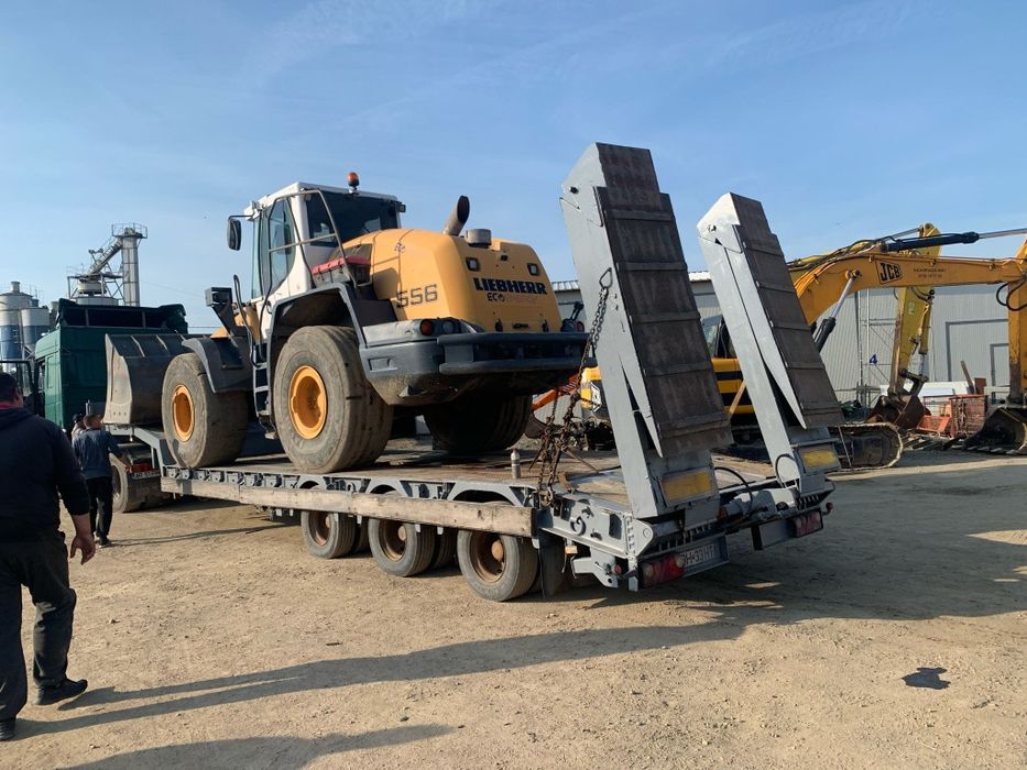 Transport utilaje cu trailer agabaritic pe latime