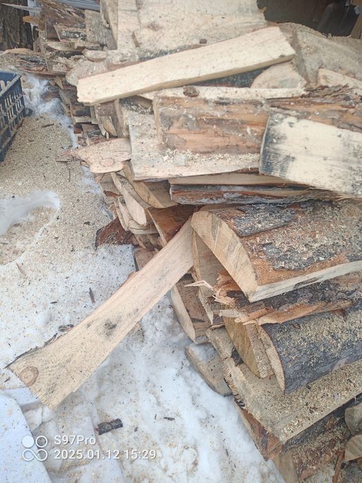 Дрова в мешках .