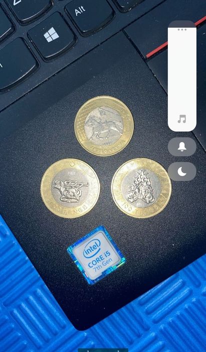 Монеты по 2000 тг каждая