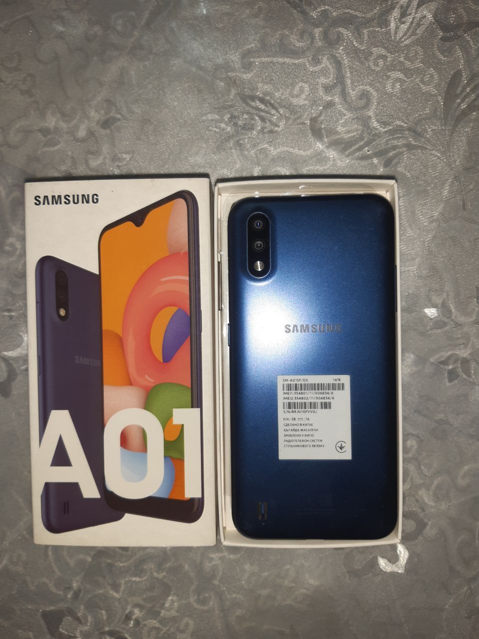 Samsung A01 hotira 32 holati yahshi ekrani usti shishasida singan ishl