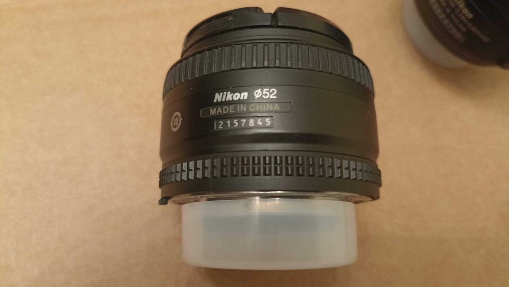 Обектив Nikon AF-S Nikkor 50mm f/1.8D + още един + филтри