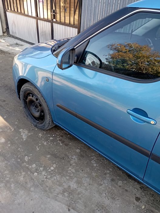 skoda roomster 1.2 benzina an 2009