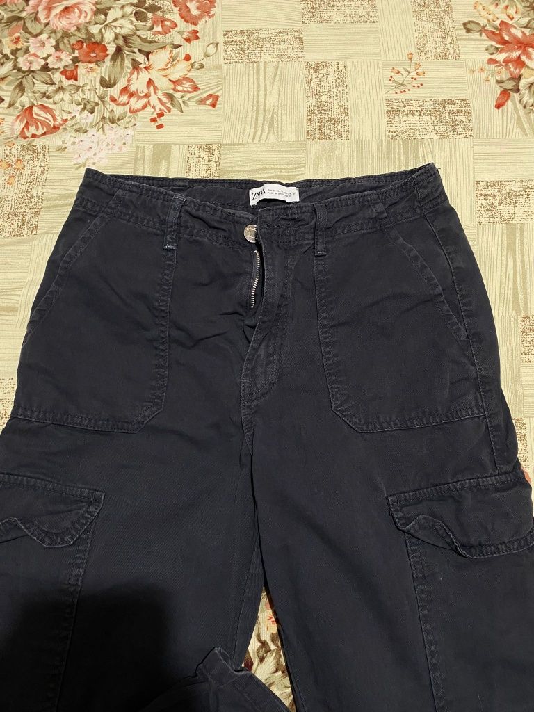 blugi Zara, Cargo